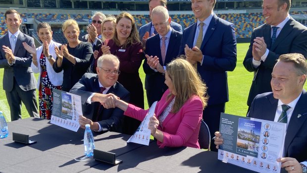 Prime Minister Scott Morrison, Queensland Premier Annastacia Palaszczuk and Brisbane lord mayor Adrian Schrinner signing the SEQ City Deal at the Gabba.