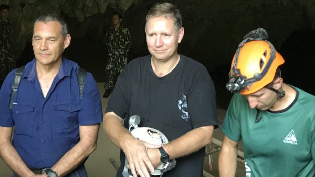 Triumphant return: Craig Challen, Richard Harris and American Joshua David Morris at the entrance to Tham Luang Cave in Thailand in 2019.