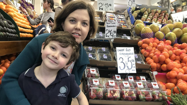 "I’m hoping that it hasn’t scared everyone off buying strawberries." Kate Felloes and her son Bennett at Galluzzo's. 