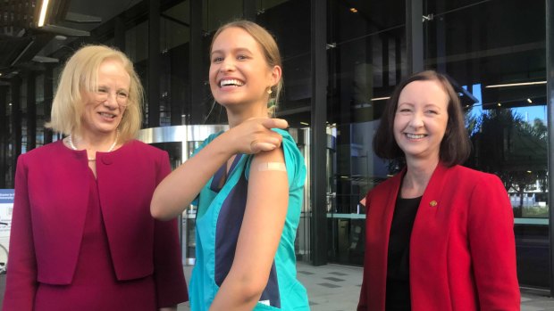 Zoe Park (centre), the first Queenslander to receive the COVID-19 vaccination, with (left) Chief Health Officer Jeannette Young and Health Minister Yvette D’Ath.