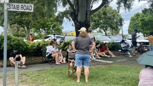 The queue for PCR testing at Brisbane’s Prince Charles Hospital stretched for 500m, with some bringing umbrellas to shield themselves from the sun.