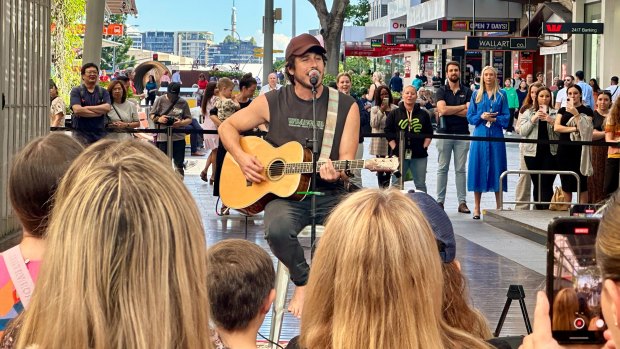 Country artist Morgan Evans plays to a lunchtime crowd in Brisbane’s Queen Street Mall.