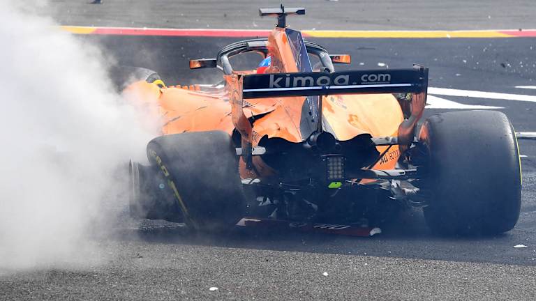The damage to Fernando Alonso's car.