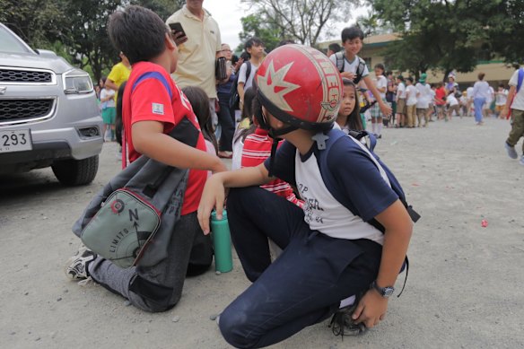 Children evacuated schools in Davao City. A tsunami warning was later called off.