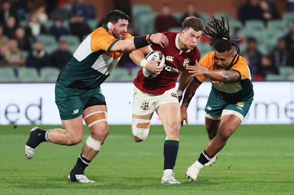 Huw Jones makes a break for the Lions.