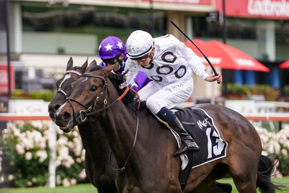 Lunar Flare ridden by Michael Dee with the colours of the former champion racehorse Taj Rossi. 