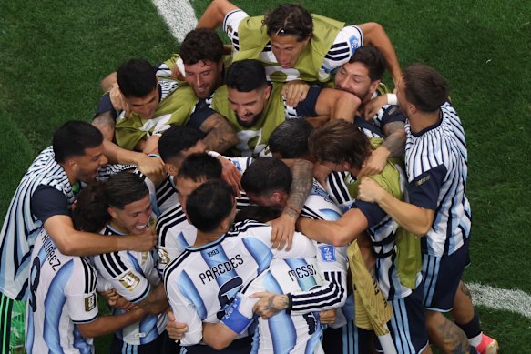 Argentina players celebrating after Lionel Messi scored their second goal.
