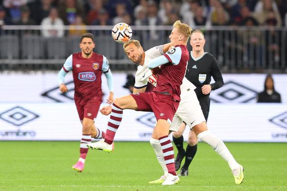 Harry Kane of Tottenham and Flynn Downes of West Ham tussle for the ball at Optus Stadium on Tuesday.