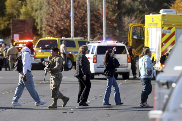 Police evacuate people after a shooting on the University of Nevada campus in Las Vegas.