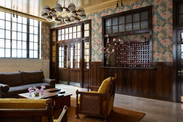 The lobby’s old-world check-in counter channels Wes Anderson.