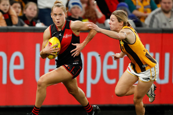 Essendon’s Steph Cain is chased by Hawthorn’s Tahlia Fellows in last year’s opener.