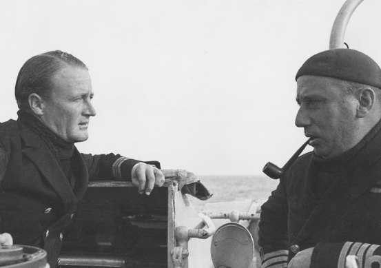 Lieutenant Commander Rodney Rhoades (left), captain of the Vendetta, with Hector “Hec” Waller, captain of the Stuart and overall commander of The Scrap Iron Flotilla.