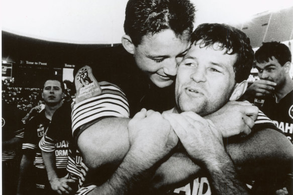 Royce Simmons celebrates the 1991 grand final win with Mark Geyer.