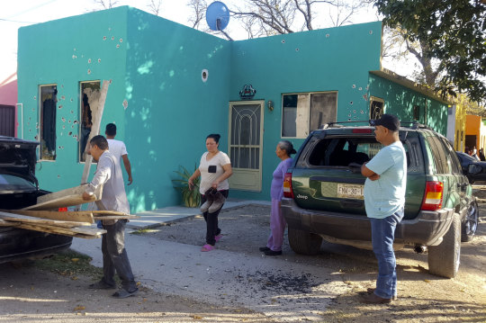 A home riddled with bullet holes in Villa Union, Mexico.