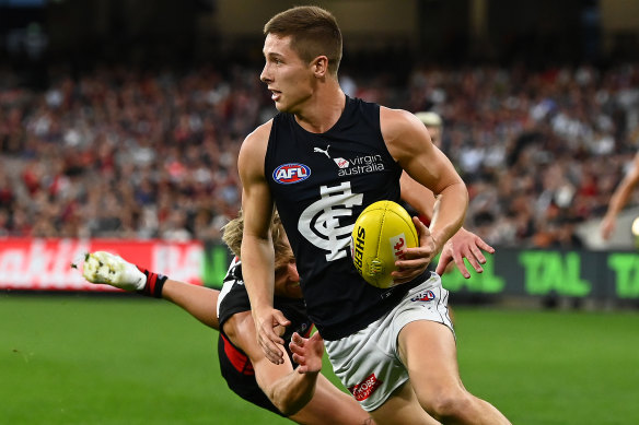 Lachie Fogarty avoids a Dyson Heppell tackle in Carlton’s win over the Dons.