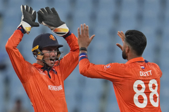 Netherlands captain and wicketkeeper Scott Edwards celebrates a wicket at the World Cup with teammate Aryan Dutt.