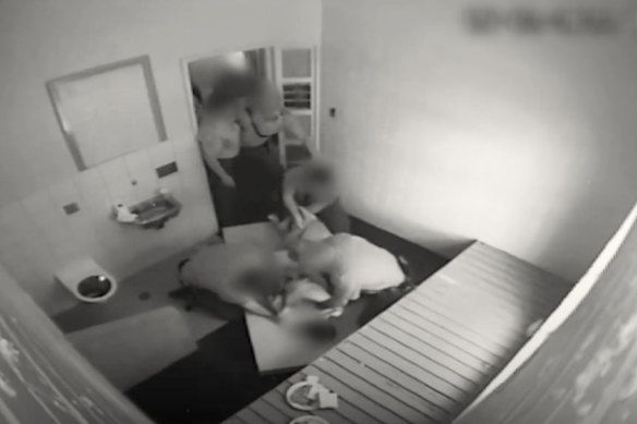 Vision from inside Banksia Hill Detention Centre where officers use a technique known as ‘folding up’ to restrain a detainee.