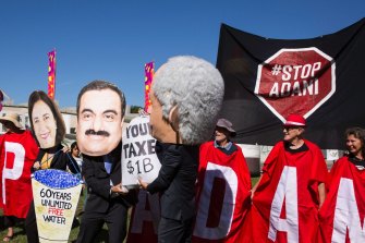 People gather at Parliament House in Canberra in February to protest the proposed Adani mine.