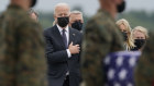 President Joe Biden watches as caskets carrying the bodies of Americans killed in Kabul are unloaded at Dover Air Force Base in Delaware.