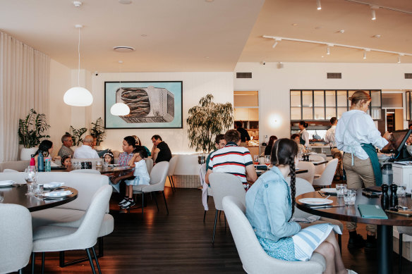 A seat inside at Fosh lands you in a warmly detailed dining room.