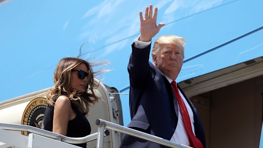 President Donald Trump and first lady Melania Trump board Air Force One.