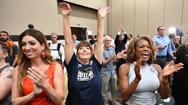 People applaud during a primary watch party in Overland Park, Kansas. State voters rejected a ballot measure  in the conservative state with deep ties to the anti-abortion movement.