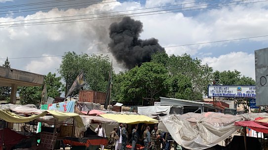 Smokes rises from a hospital after a gunmen attacked in Kabul, Afghanistan, Tuesday, May 12, 2020. Gunmen stormed the hospital in the western part of the Afghan capital on Tuesday, setting off a gun battle with the police, officials said. 