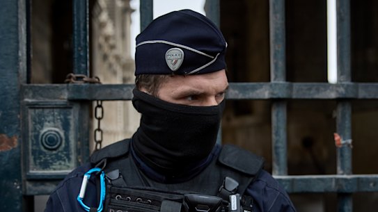 French police at the entrance to the Louvre following the heist.