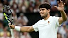 Carlos Alcaraz of Spain celebrates winning match point against Andrey Rublev. 