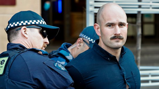 Thomas Sewell is arrested outside a Melbourne court on Tuesday.