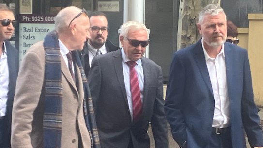 Barry Cable enters court with his barrister, Tom Percy KC.