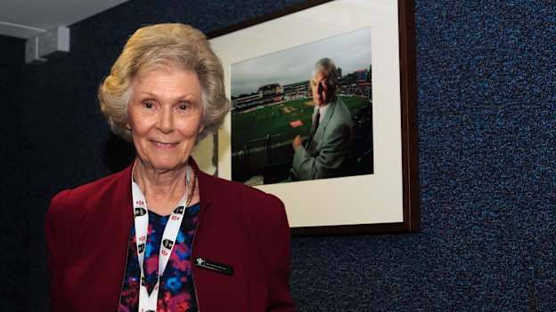Daphne in the broadcast centre during the Ashes at The Oval in 2023, with a photo of Richie behind her.