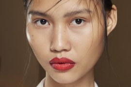 Make-up artist Diane Kendal used a punchy red lip with a backdrop of fresh dewy skin and a nude eye for this look.