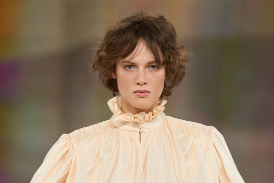 Shaggy bohemian fringes with a “grown out” feel on the Chloé Fall/Winter 2026 runway.
