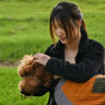 Vivy Li stands outside the disused old Box Hill Brickworks site with her dog Leo.