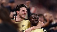 Bukayo Saka of Arsenal celebrates scoring with Declan Rice.