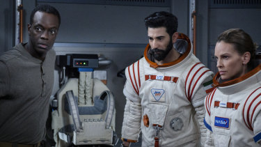 Ato Essandoh, Ray Panthaki and Hilary Swank in Away. 