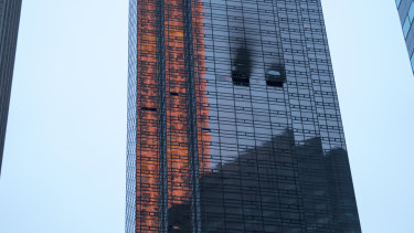 Fire damage can be seen at Trump Tower after a fire broke out on the 50th floor. 