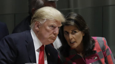 Donald Trump talks to Nikki Haley, the US ambassador to the United Nations, at the United Nations General Assembly on Monday in New York. 
