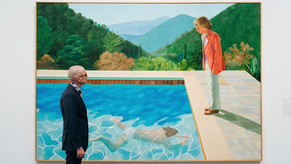 A viewer looks at David Hockney’s Portrait of an Artist (Pool with Two Figures) at a retrospective exhibition last year.