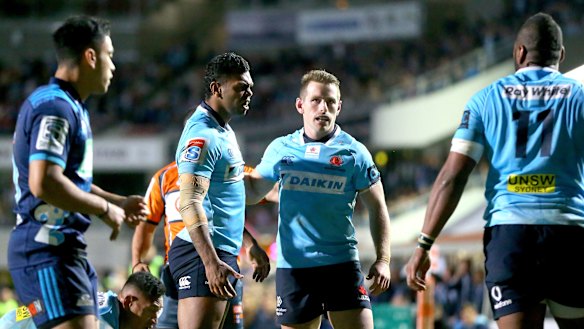 Blue murder: Kurtley Beale and Bernard Foley share a moment at Brookvale Oval on Saturday night.