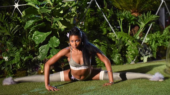 A model does the splits at the Savage x Fenty show at NYFW.