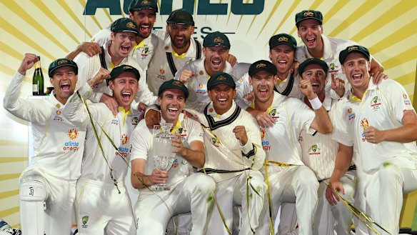 Pat Cummins and the victorious Australia team celebrate their Ashes triumph in Hobart.