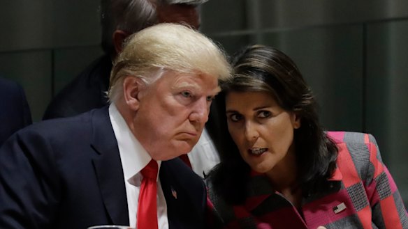 Donald Trump talks to Nikki Haley, the US ambassador to the United Nations, at the United Nations General Assembly on Monday in New York. 
