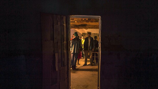 The last of the voters cast their ballots at a polling station near Harare, Zimbabwe, on Monday.