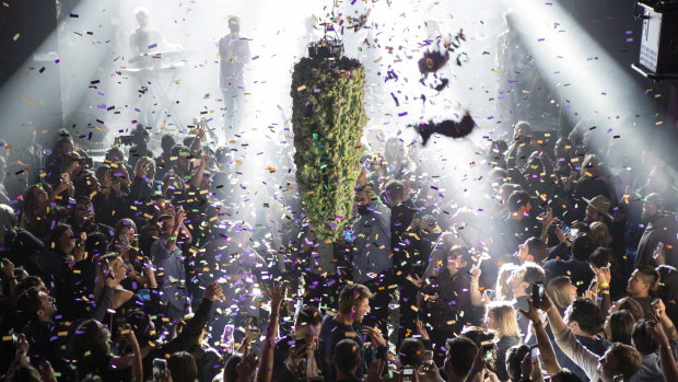 A depiction of a cannabis bud drops from the ceiling at Leafly's countdown party in Toronto, as midnight passes and marks the first day of the legalisation of cannabis across Canada.