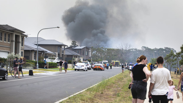 A fire is seen from Coach Street, Voyager Point, in Sydney's south-west on January 5, 2020.