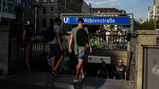 Pedestrians at the entrance of the subway station at Mohrenstrasse, or Mohren Street, Berlin. Activists are calling to rename the street, as Mohren is generally considered a racist insult referring to dark-skinned people. 