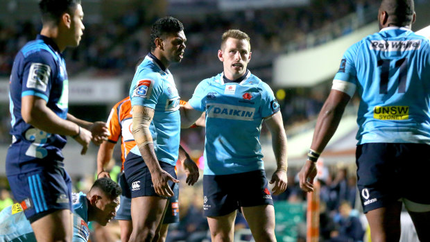 Passion: The Waratahs' battle against the Blues drew a crowd to Brookvale Oval