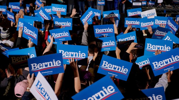 Highly motivated. Placards are held aloft by supporters of Senator Bernie Sanders at a rally for the presidential primary candidate at a high school in Las Vegas. 